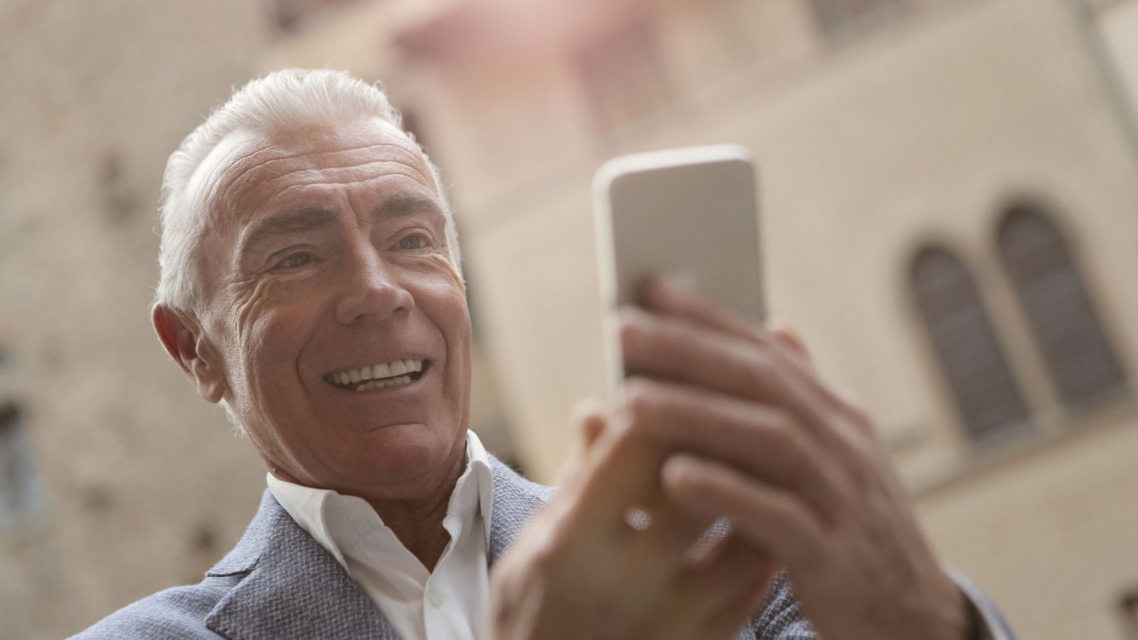Senior executive smiling on a call