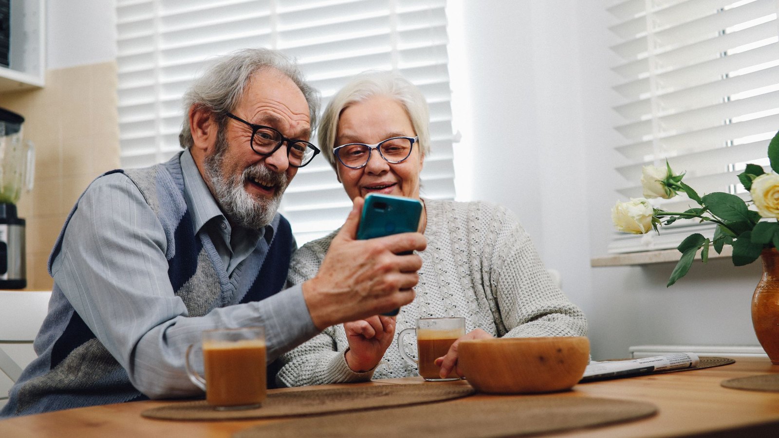 Grandparents waving on a video call