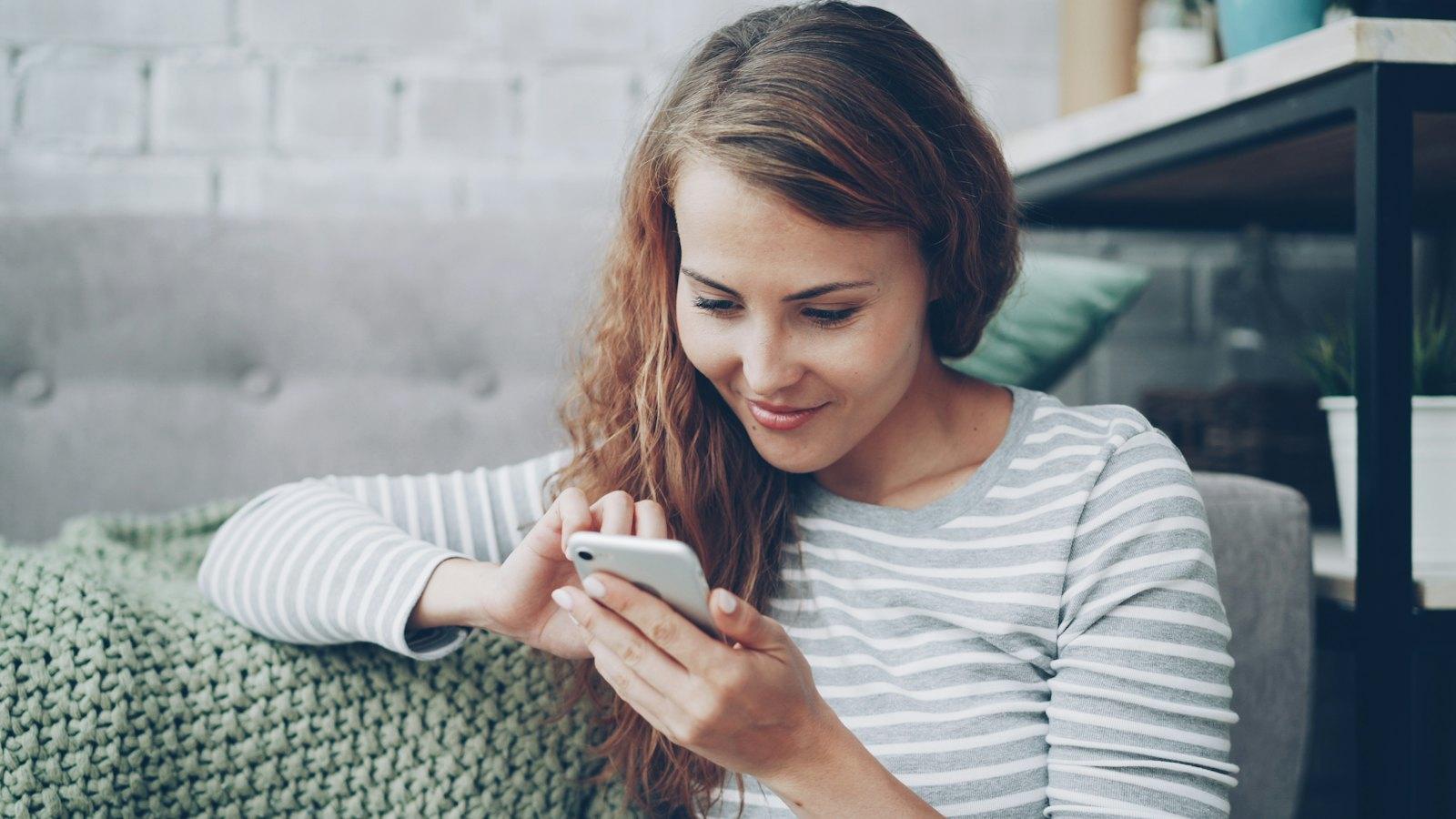 Woman reading a text from a lead